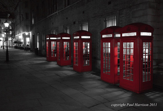 Red phone boxes at night, London