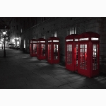 Red phone boxes at night, London